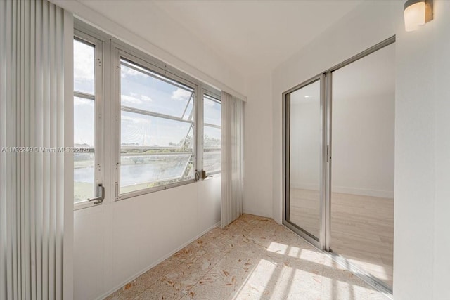 interior space with a water view and a closet
