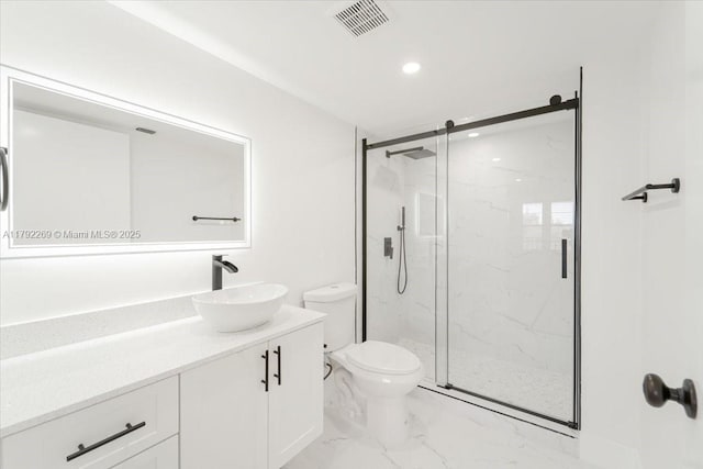 bathroom with visible vents, a marble finish shower, toilet, vanity, and marble finish floor
