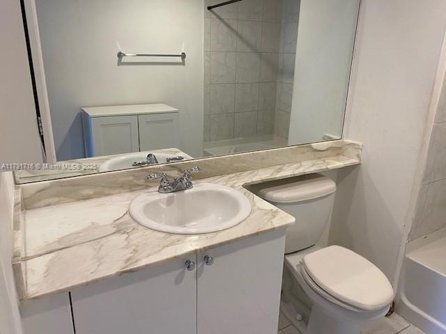 full bathroom with toilet and vanity