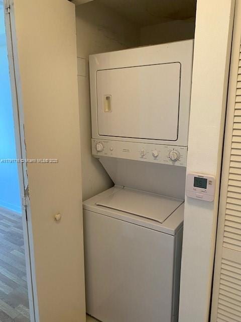 laundry room featuring stacked washing maching and dryer and laundry area