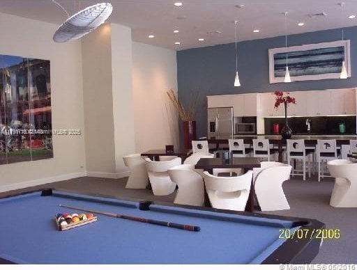 rec room with a towering ceiling, recessed lighting, and pool table