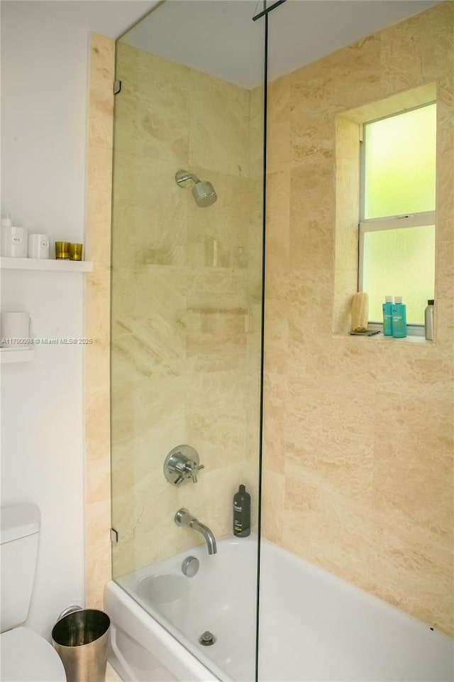 full bath featuring toilet and shower / washtub combination