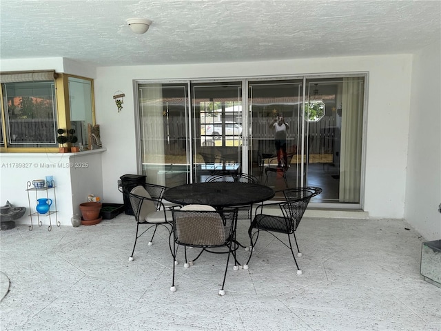 1011 SE 12th Ave, Deerfield Beach, FL 33441 - dining area with a textured ceiling