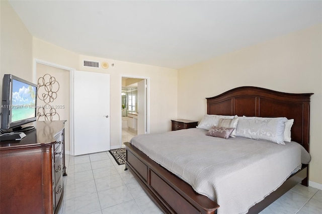 bedroom featuring visible vents and ensuite bath