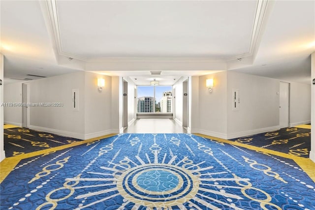 hallway with baseboards and crown molding