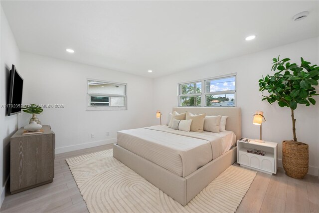 bedroom featuring recessed lighting and light wood-style flooring