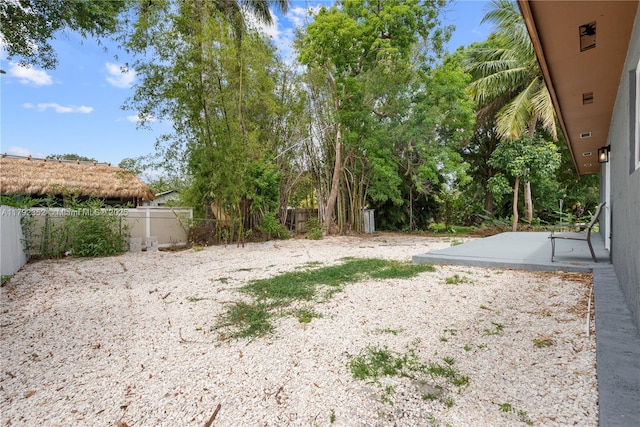 view of yard with a fenced backyard and a patio area