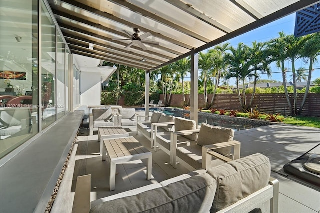 view of patio featuring outdoor lounge area, ceiling fan, and a fenced backyard
