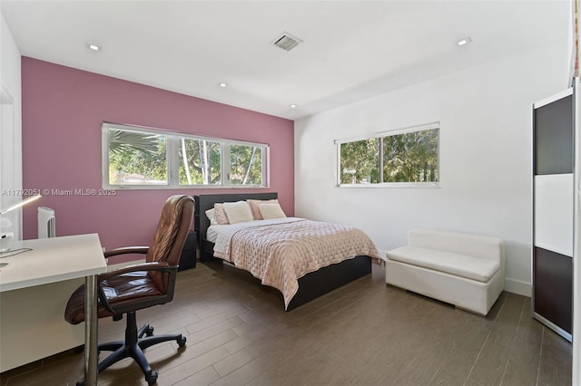 bedroom featuring wood finished floors, visible vents, and recessed lighting