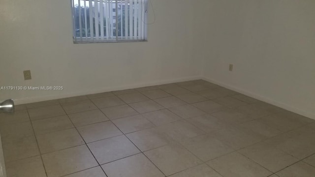 8240 SW 210th St Unit 313, Cutler Bay, FL 33189 - tiled empty room featuring baseboards