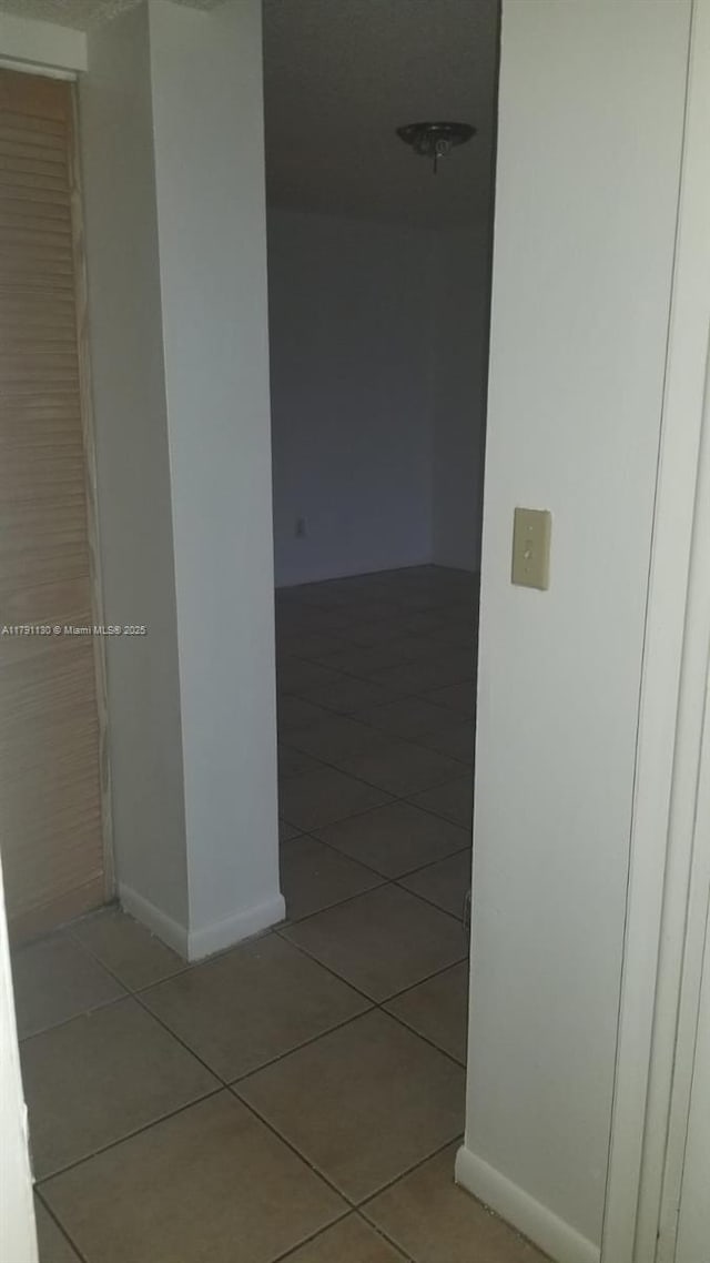 8240 SW 210th St Unit 313, Cutler Bay, FL 33189 - hall featuring tile patterned flooring and baseboards