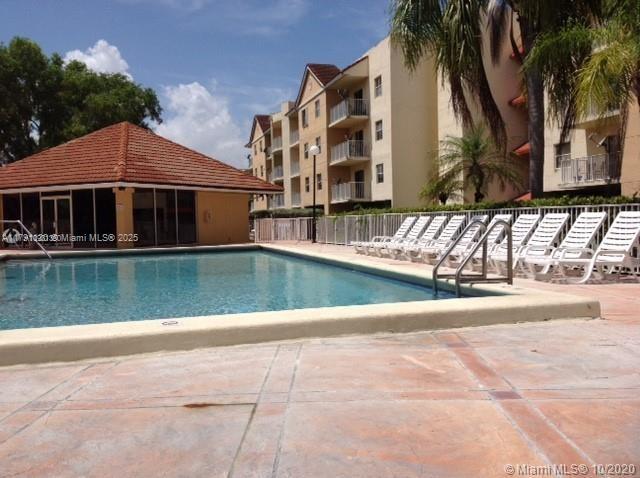 8240 SW 210th St Unit 313, Cutler Bay, FL 33189 - pool with a patio and fence