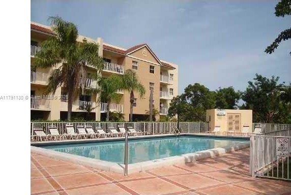8240 SW 210th St Unit 313, Cutler Bay, FL 33189 - pool featuring a patio area and fence