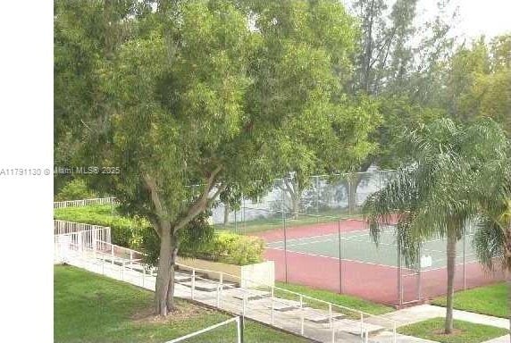 8240 SW 210th St Unit 313, Cutler Bay, FL 33189 - view of tennis court featuring fence