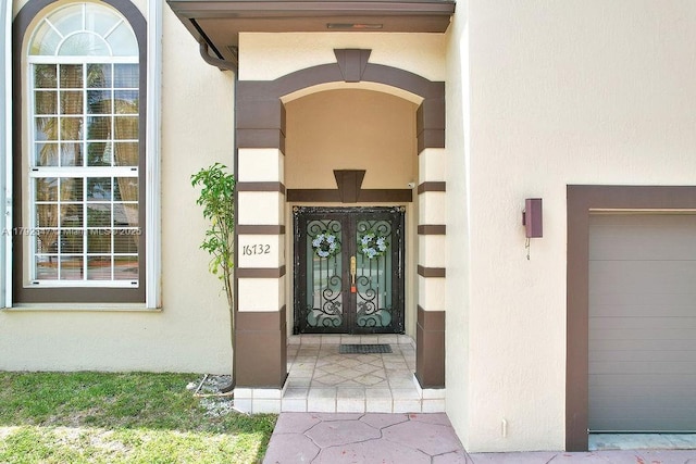 property entrance with stucco siding