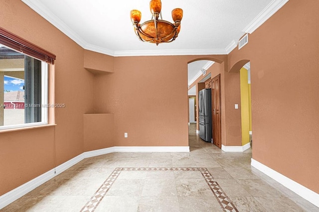empty room with visible vents, baseboards, an inviting chandelier, arched walkways, and ornamental molding