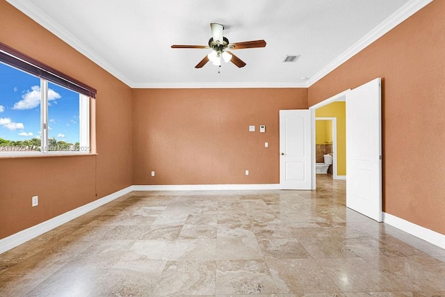 spare room with baseboards, visible vents, ornamental molding, and ceiling fan