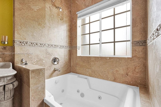 full bathroom with a whirlpool tub and tile walls