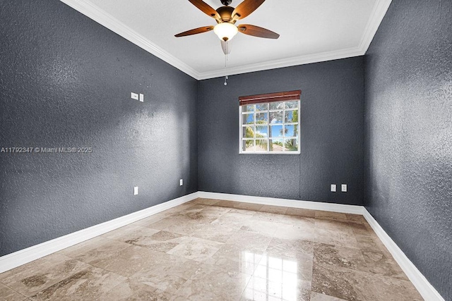 spare room with stone tile floors, ornamental molding, ceiling fan, and a textured wall