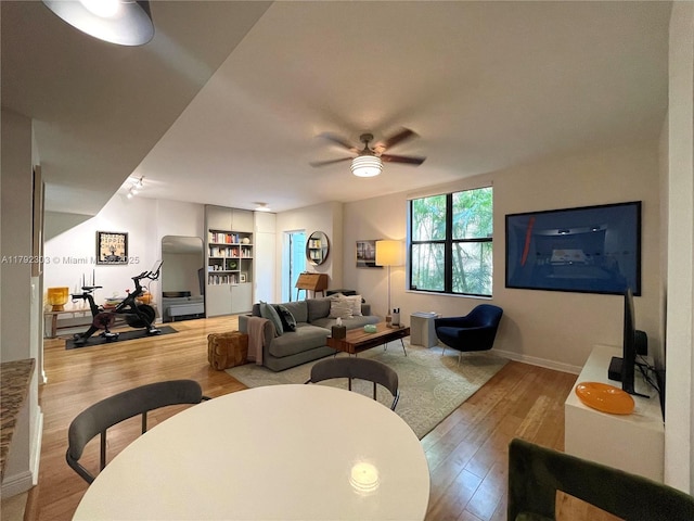888 S Douglas Rd Unit 119, Coral Gables, FL 33134 - living room featuring ceiling fan, wood finished floors, and baseboards