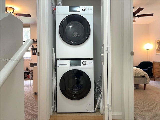 888 S Douglas Rd Unit 119, Coral Gables, FL 33134 - clothes washing area with light colored carpet, stacked washer / drying machine, a ceiling fan, and laundry area
