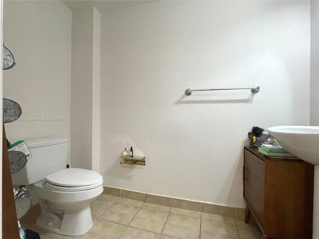 888 S Douglas Rd Unit 119, Coral Gables, FL 33134 - half bath featuring tile patterned floors, toilet, vanity, and baseboards