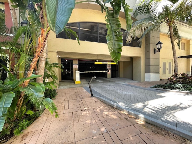 888 S Douglas Rd Unit 119, Coral Gables, FL 33134 - exterior space with stucco siding and french doors