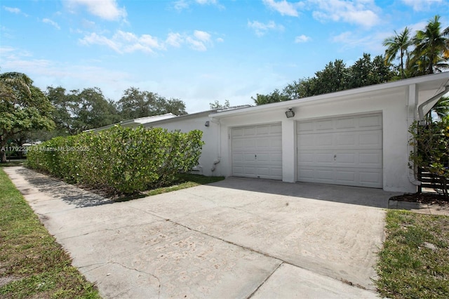 garage featuring driveway