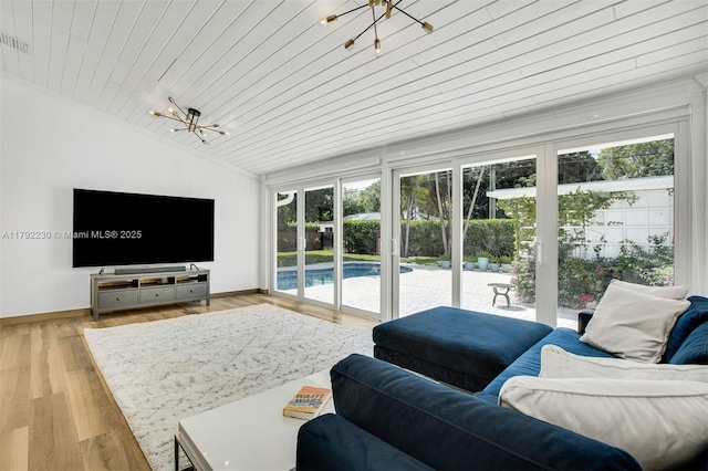living area featuring wood ceiling, a chandelier, visible vents, vaulted ceiling, and wood finished floors