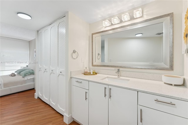 bathroom featuring vanity and wood finished floors
