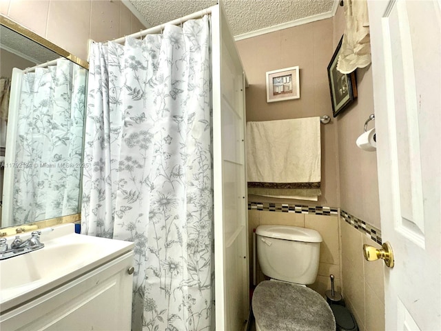 8135 W 9th Ave, Hialeah, FL 33014 - full bathroom featuring tile walls, vanity, toilet, ornamental molding, and a textured ceiling