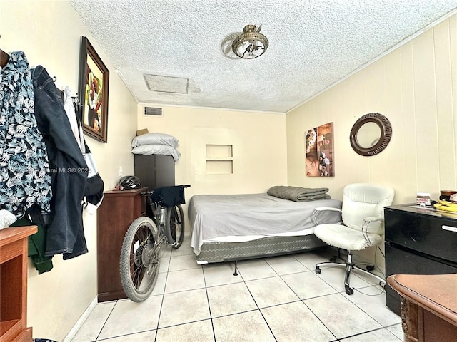 8135 W 9th Ave, Hialeah, FL 33014 - bedroom with light tile patterned flooring, visible vents, ornamental molding, and a textured ceiling