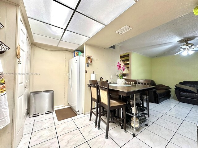 8135 W 9th Ave, Hialeah, FL 33014 - dining area with visible vents, a ceiling fan, and light tile patterned flooring