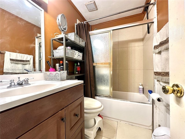 8135 W 9th Ave, Hialeah, FL 33014 - full bathroom featuring bath / shower combo with glass door, visible vents, toilet, vanity, and tile patterned flooring