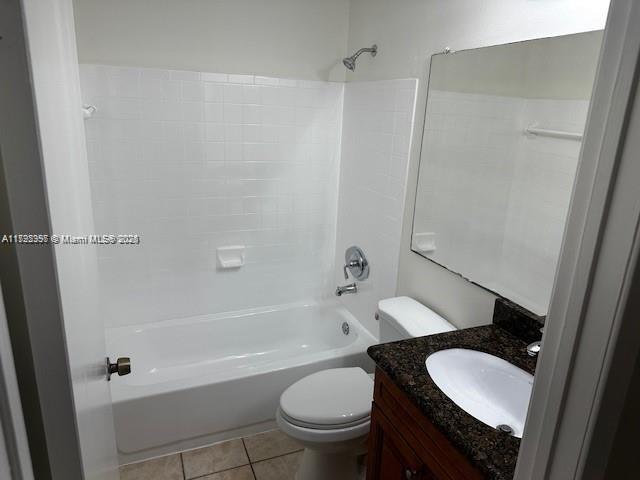 11229 W Atlantic Blvd Unit 204, Coral Springs, FL 33071 - full bathroom with shower / tub combination, vanity, toilet, and tile patterned flooring