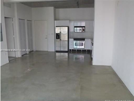 234 NE 3rd St Unit 1208, Miami, FL 33132 - garage with stainless steel refrigerator with ice dispenser