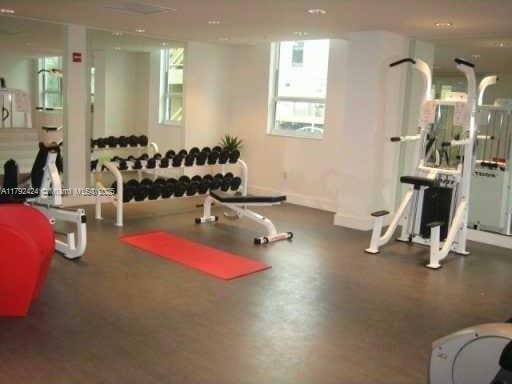 234 NE 3rd St Unit 1208, Miami, FL 33132 - workout area featuring baseboards and a healthy amount of sunlight
