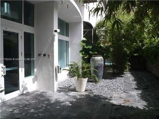 234 NE 3rd St Unit 1208, Miami, FL 33132 - exterior space with stucco siding and french doors