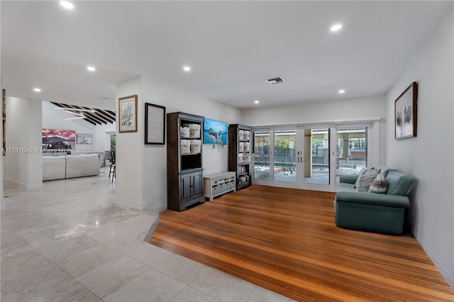 living room with french doors, recessed lighting, and visible vents
