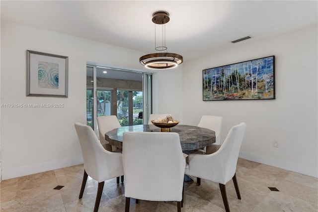 dining area with visible vents and baseboards