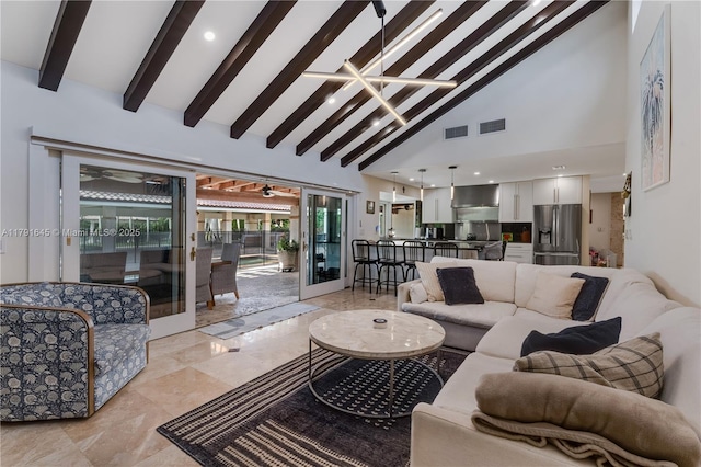 living room featuring visible vents, beamed ceiling, and high vaulted ceiling