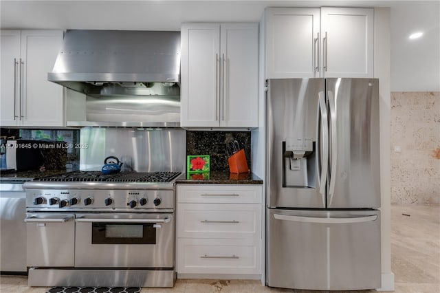 kitchen with decorative backsplash, stainless steel appliances, range hood, and white cabinets