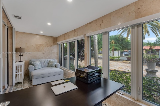sunroom featuring a healthy amount of sunlight, recessed lighting, and visible vents