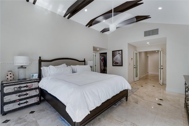 bedroom with recessed lighting, a spacious closet, beam ceiling, visible vents, and high vaulted ceiling