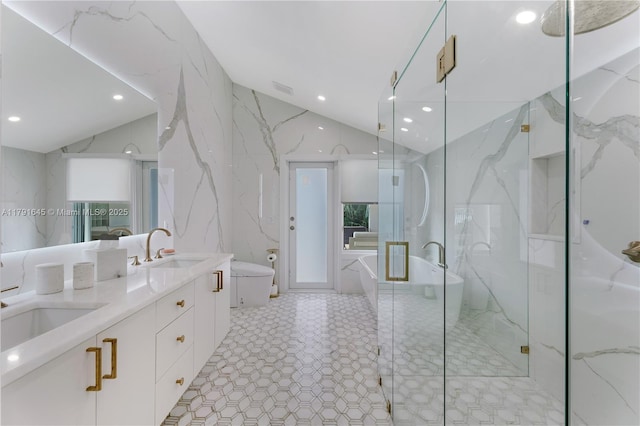 full bathroom with recessed lighting, a marble finish shower, vaulted ceiling, and a sink