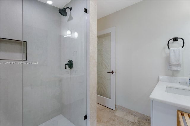 full bath featuring a stall shower and vanity