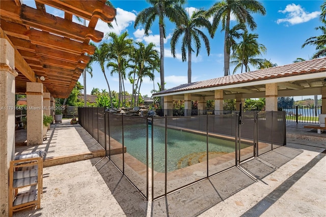 view of pool featuring fence