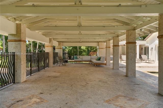 view of patio featuring an outdoor living space, fence, and a gazebo