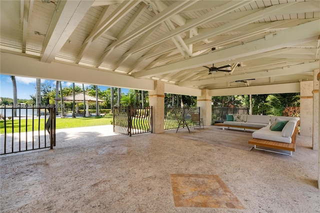 view of patio / terrace featuring fence, a gazebo, a ceiling fan, and an outdoor hangout area