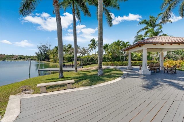 view of community with a yard, a gazebo, and a water view